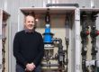 Scotmas CEO, Alistair Cameron, in front of some Scotmas’ advanced water disinfection equipment.