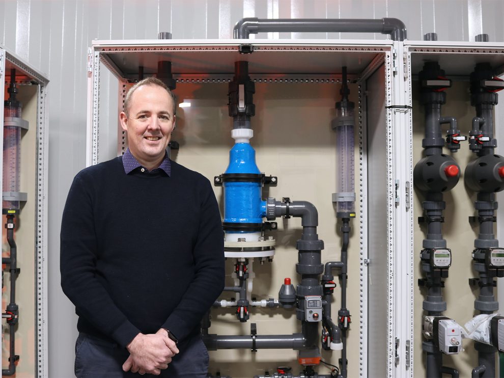 Image One Scotmas CEO, Alistair Cameron, in front of some Scotmas’ advanced water disinfection equipment.