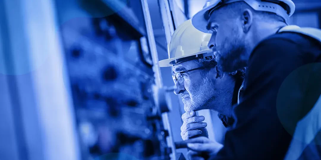 Two engineers looking at a system
