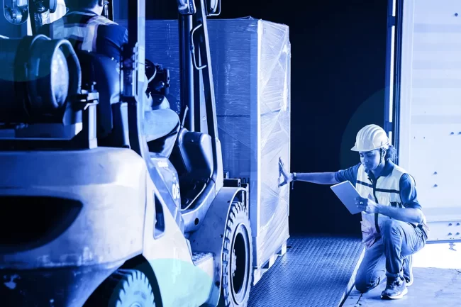Stores Person Person working with forklift and checking stock